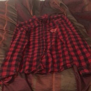 This is a red button up shirt rarely used